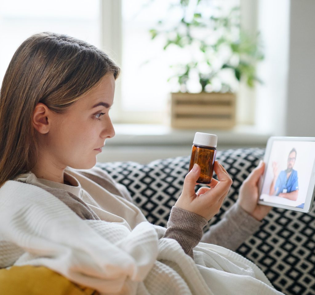young-woman-having-video-call-with-doctor-on-tablet-at-home-online-consultation-concept-.jpg